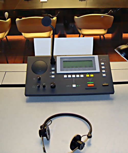 An interpreter’s desk. 
 Photo by Tiina Hyvärinen, 2009, CC-BY-SA